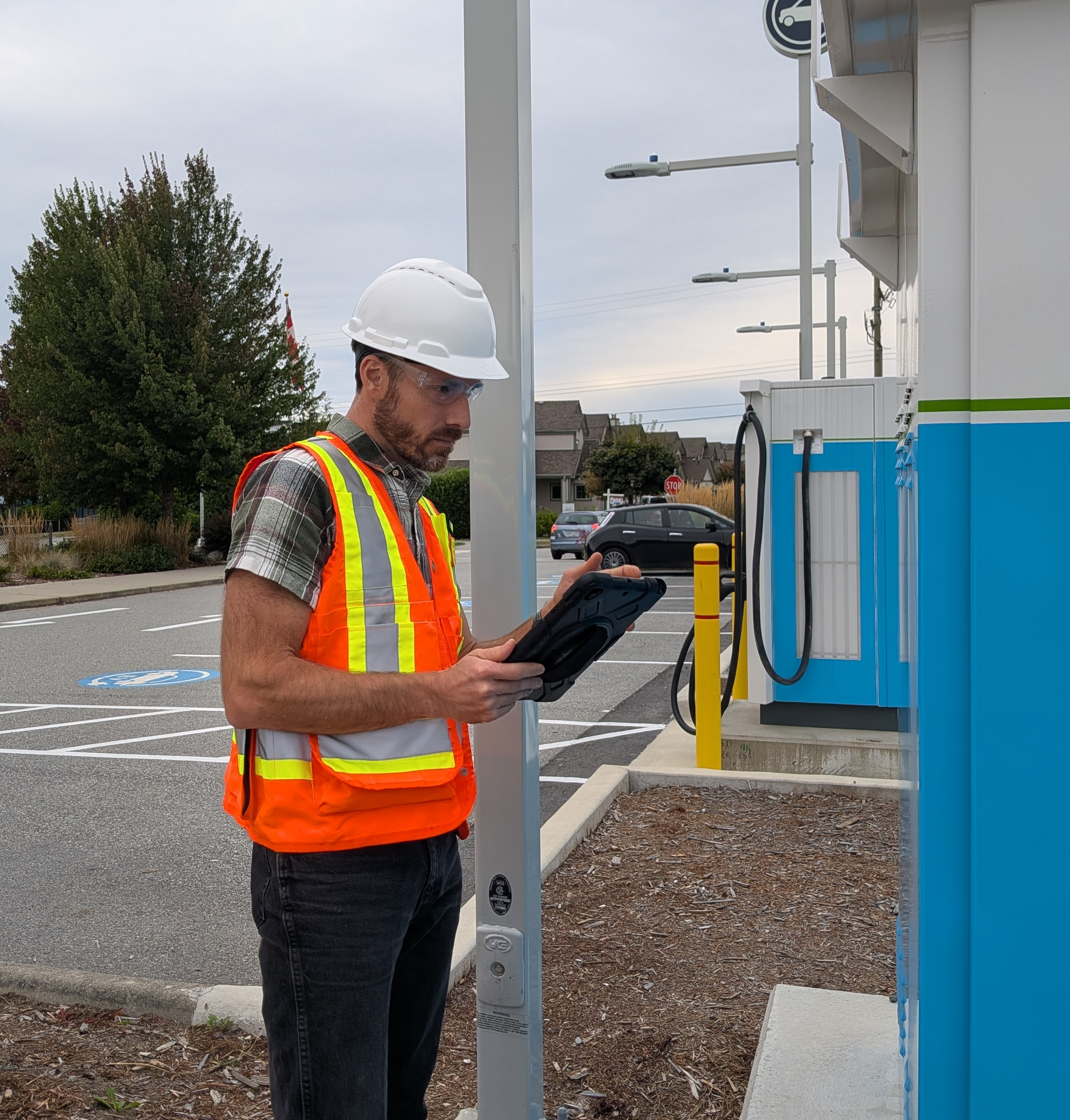 Neil MacEachern verifying quality on electrical project in Gibsons, British Columbia